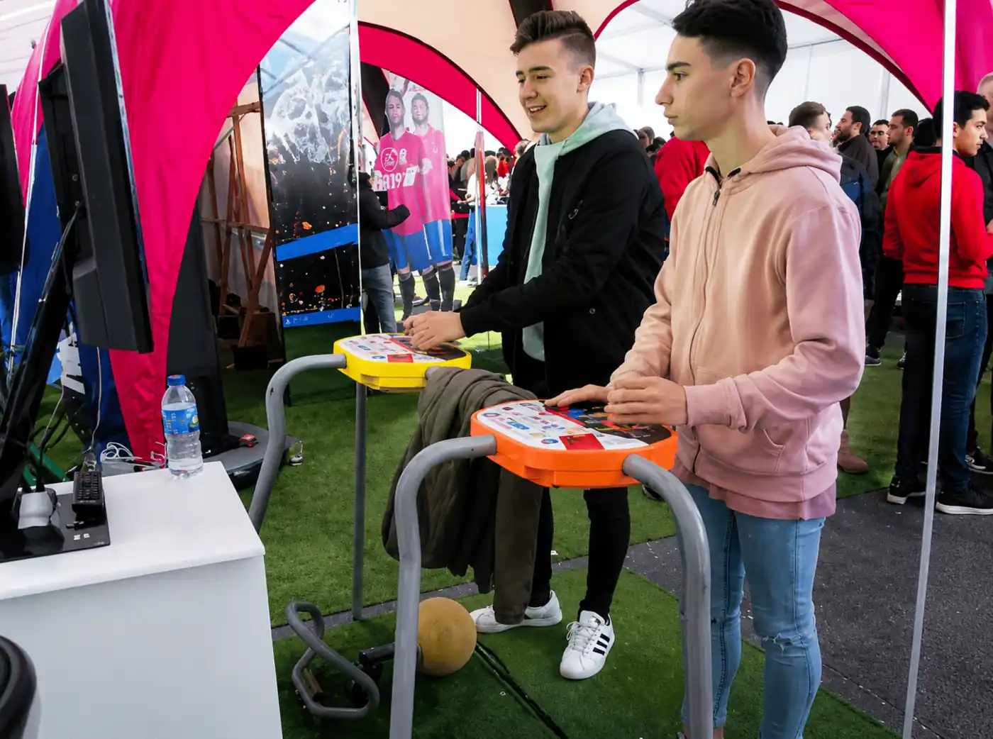 Players kicking the ball at a football arcade event