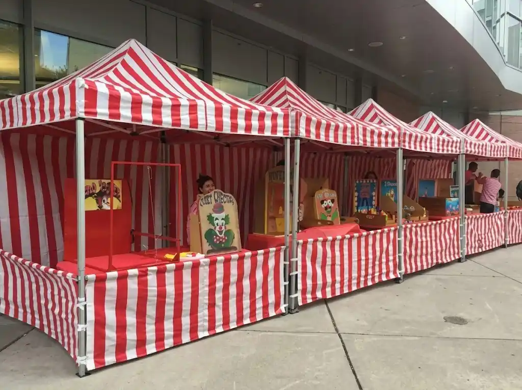 Funfair stalls with games at a company family day