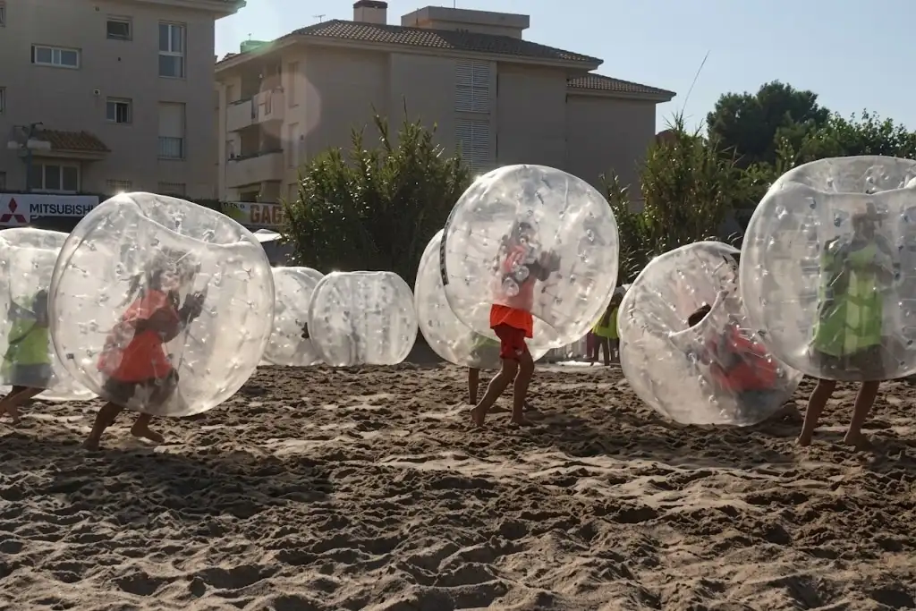 Children playing bubble football at a school