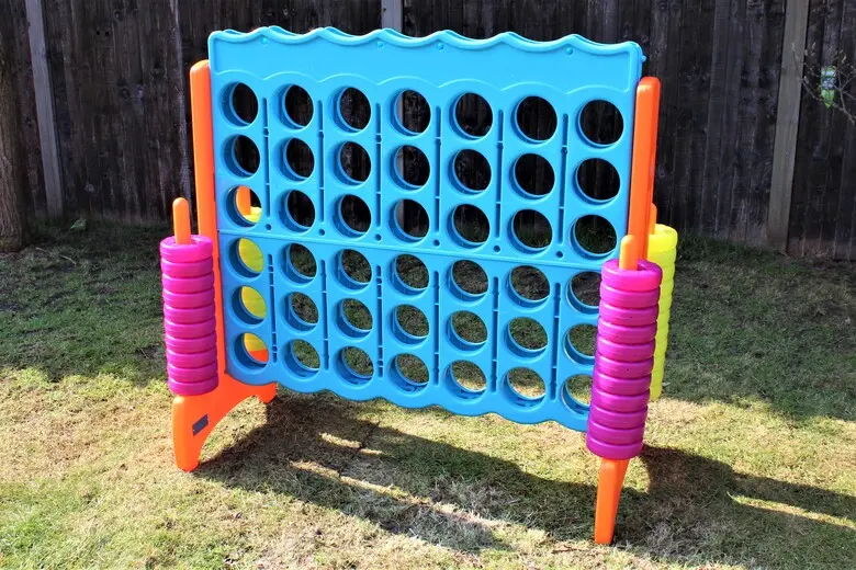 Children playing giant Connect 4 at a school