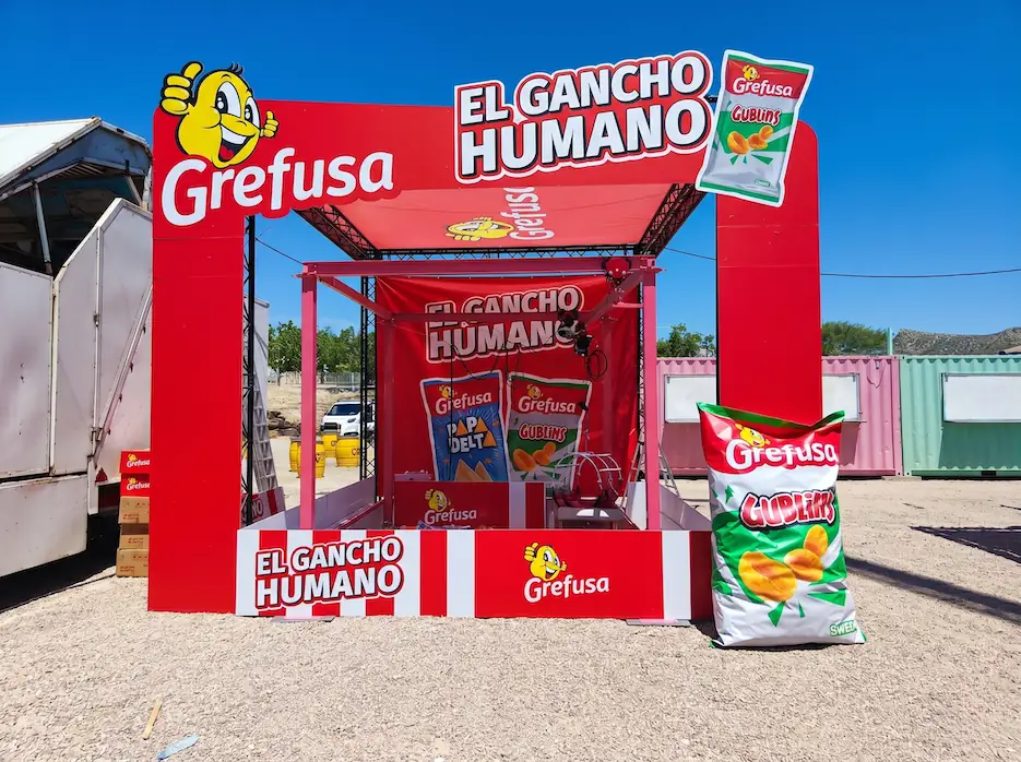 Human claw machine at a corporate family day