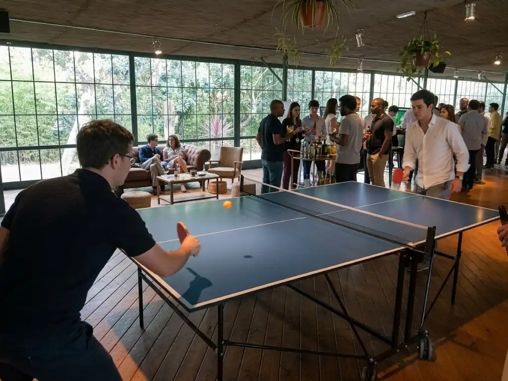 Wedding guests playing table tennis in the garden