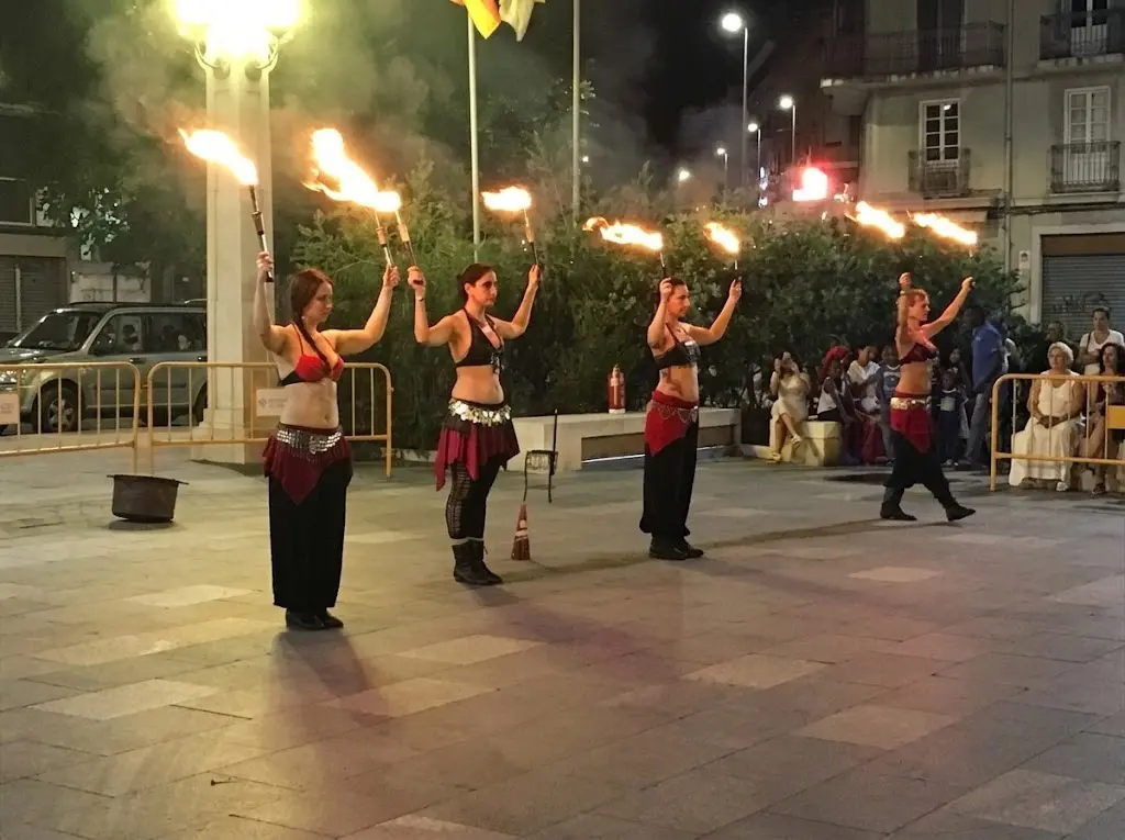 Fire show with fans at a midsummer celebration