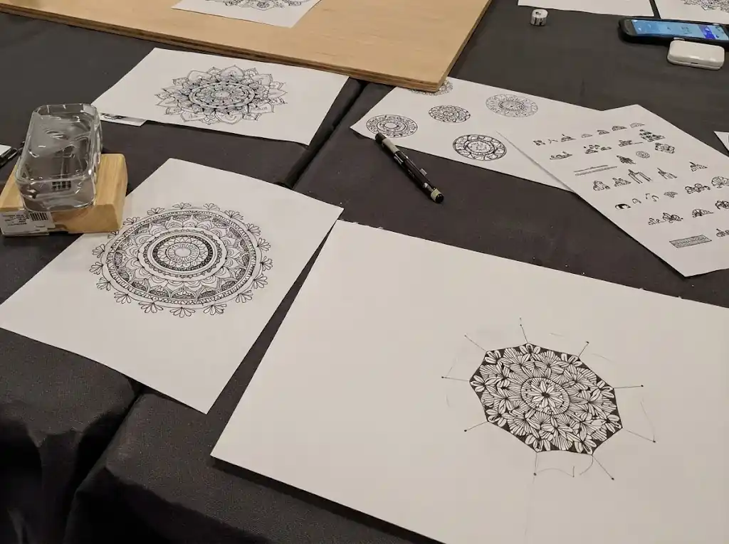 Children colouring geometric mandalas at a family day in Barcelona