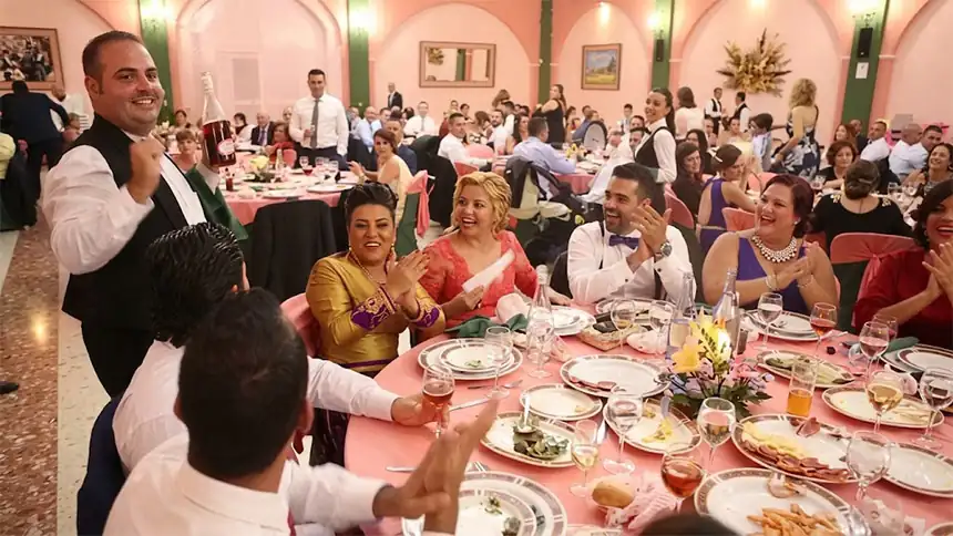 Surprise actor dressed as a waiter at a gala dinner