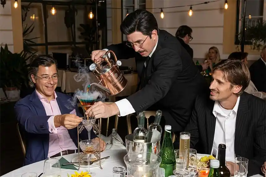 Undercover waiter getting laughs at a company Christmas dinner