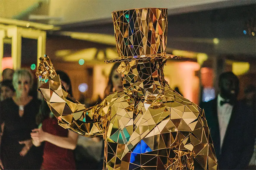Golden mirror man at a corporate Gatsby themed party