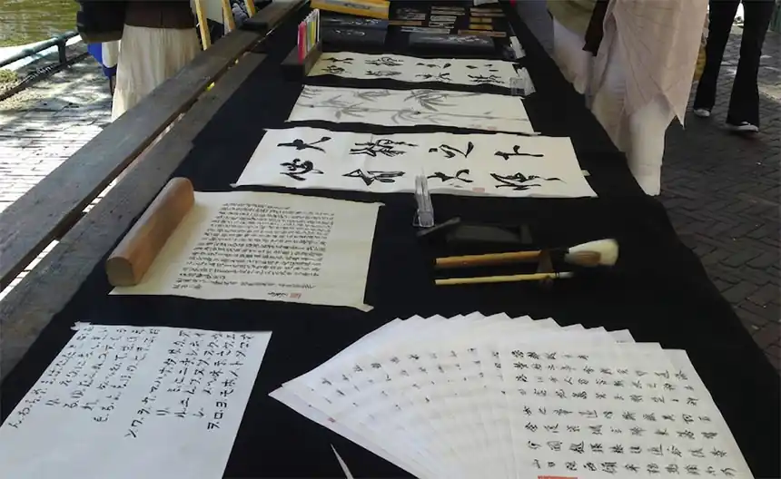 Japanese calligraphy workshop for employees with brush and ink
