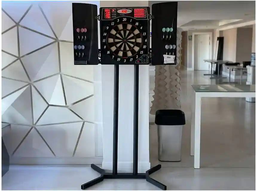 Guests throwing darts at a company Christmas party