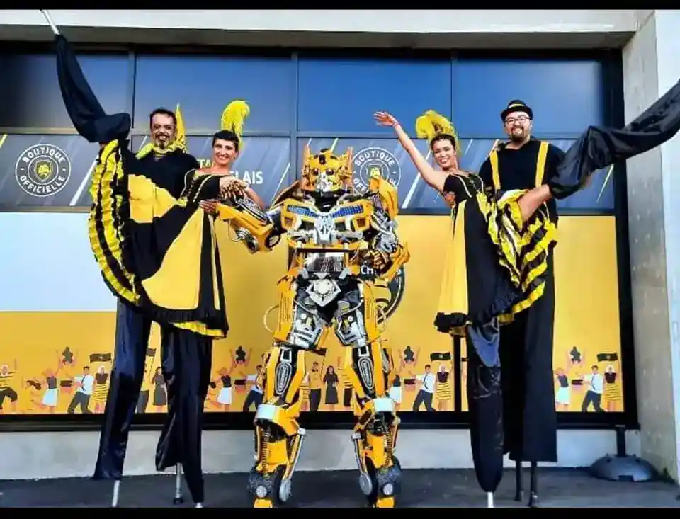 Bumblebee stilt walker in a street parade