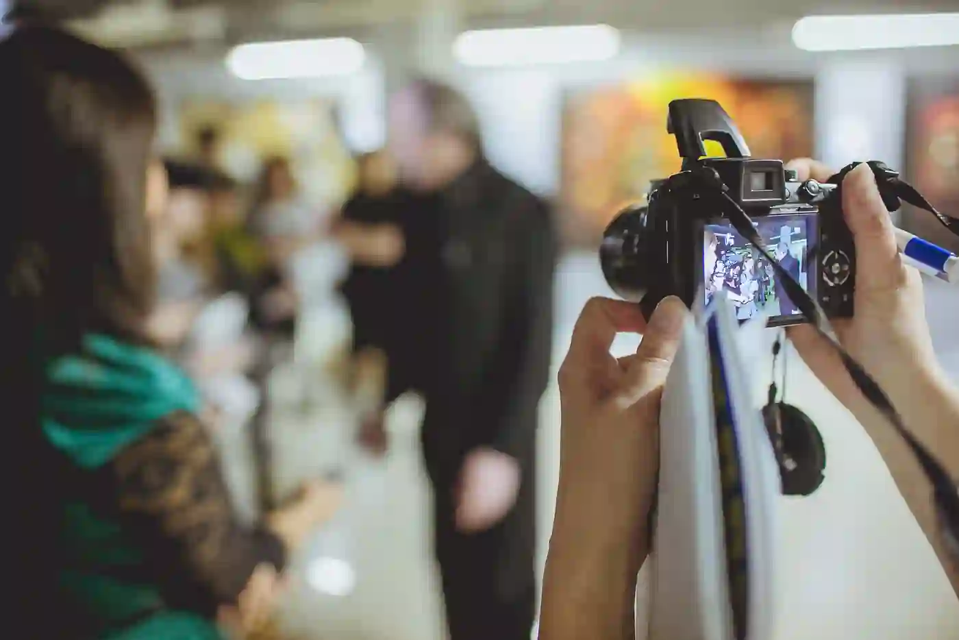 Videographer filming a talk at a conference