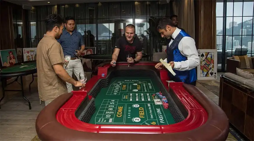 Croupier running the craps table at a Christmas dinner
