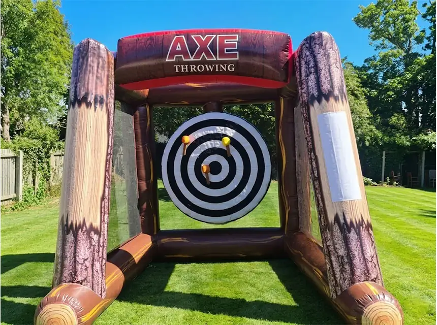 Guest throwing a velcro axe at a Viking themed party
