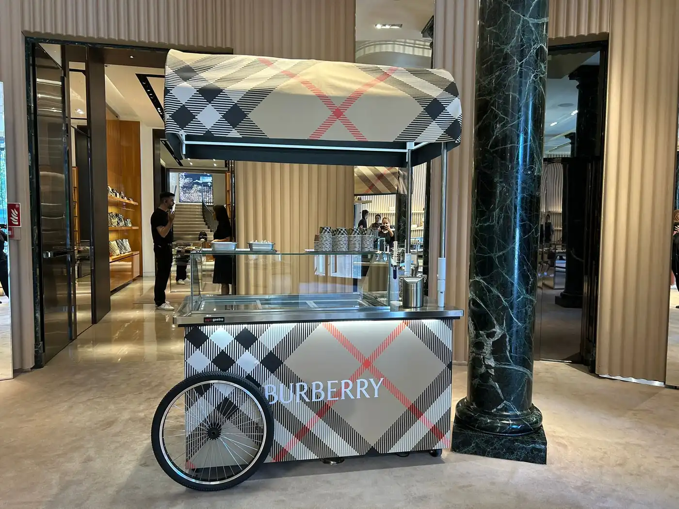 Artisan ice cream cart at an outdoor wedding