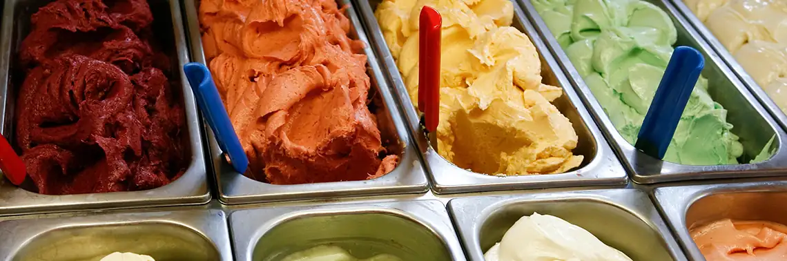 Server scooping ice cream at a company event