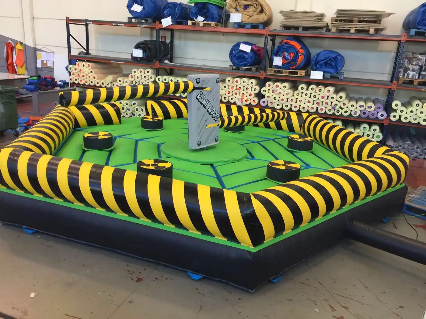 Inflatable sweeper at a town festival with a crowd watching