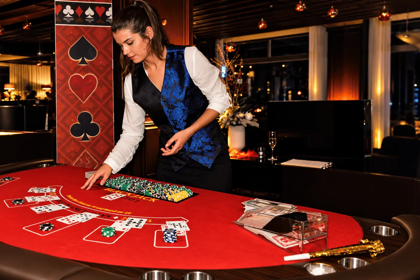 Croupier dealing cards at a blackjack table during an event