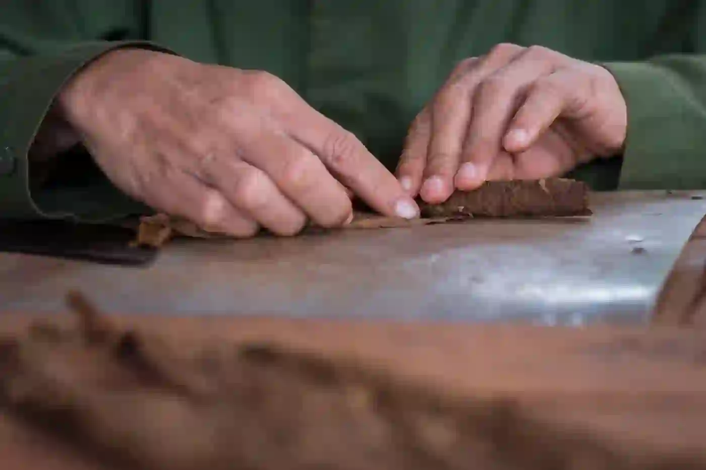 Hands of the master roller wrapping the wrapper leaf