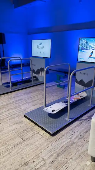 Teenager on a snowboard simulator in a Christmas shopping centre