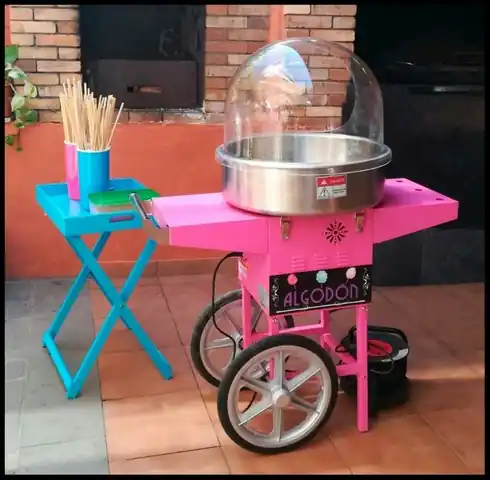 Pink candyfloss at a christening with a sweet table