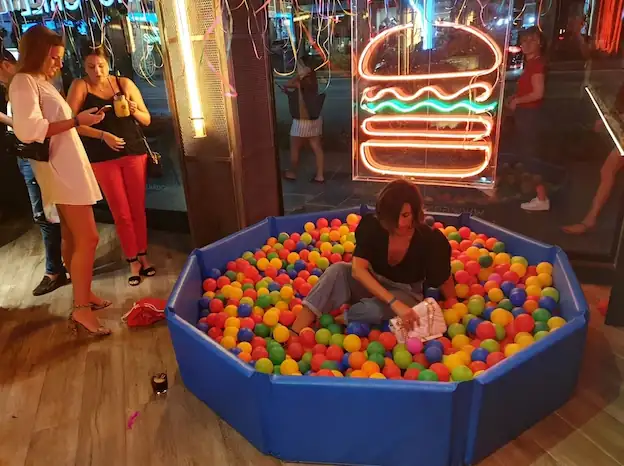 Children playing in a ball pit at a family day