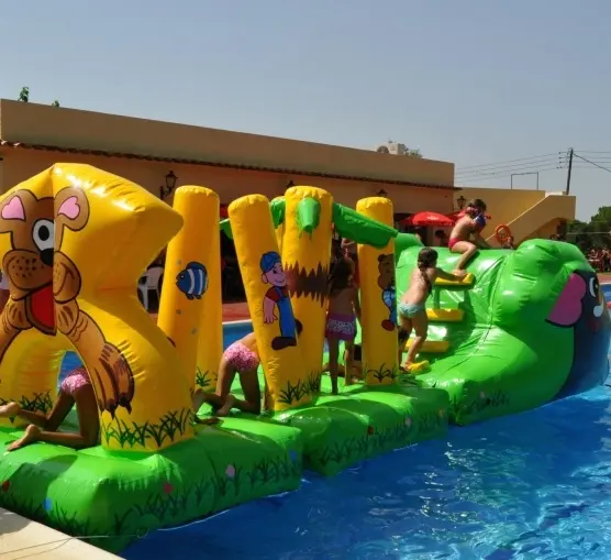 Children playing on a pool inflatable at a kids’ party
