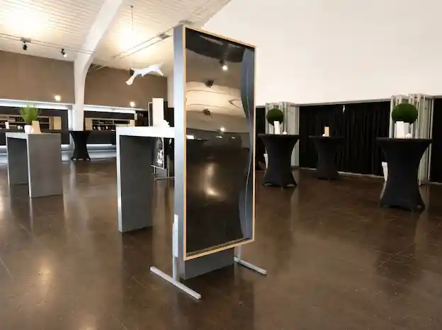 Funhouse mirrors at a Halloween fancy dress party