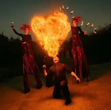 Fire stilt walker show at a town festival