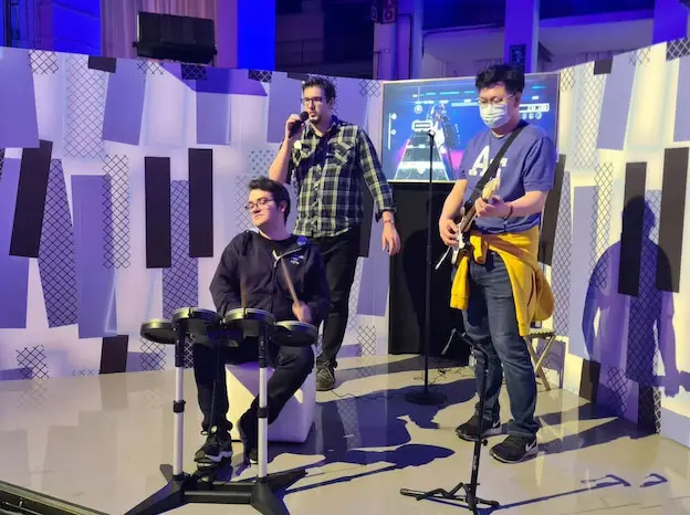 Children playing a guitar video game at a birthday party